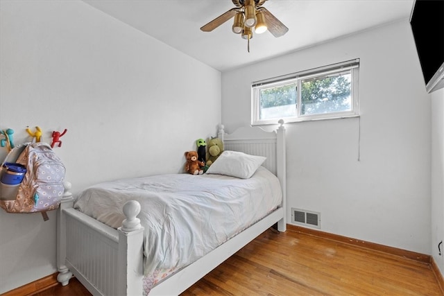 bedroom featuring ceiling fan and wood-type flooring