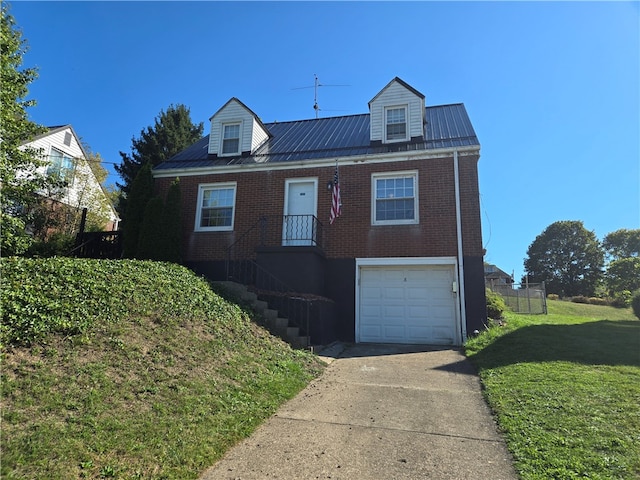 view of front of home featuring a front lawn and a garage