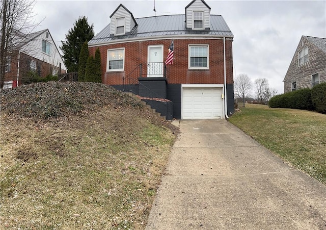 view of front of property with a front yard and a garage