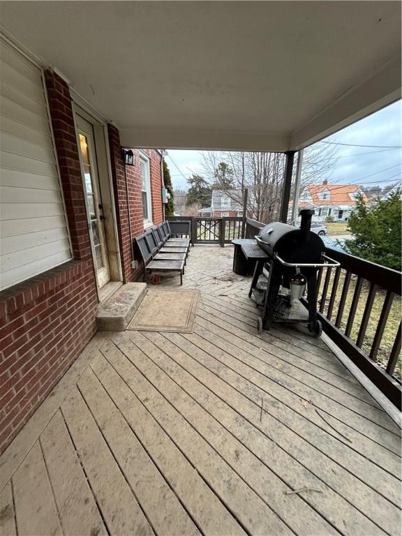 wooden deck featuring grilling area