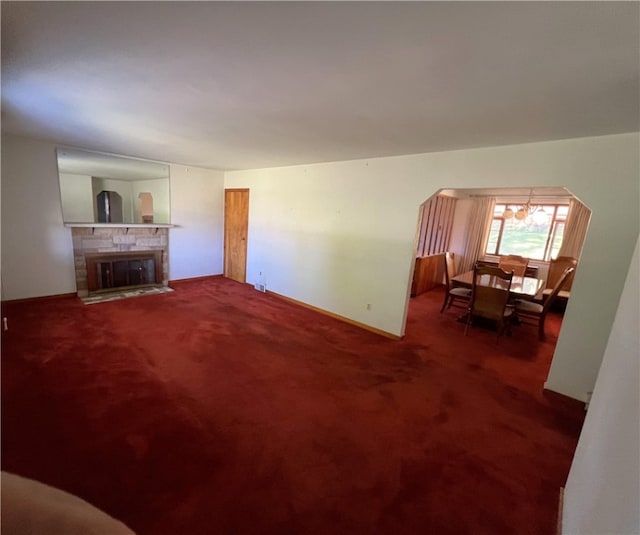 living room featuring carpet floors and a fireplace