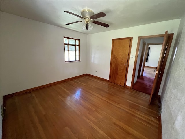 unfurnished bedroom with wood-type flooring and ceiling fan