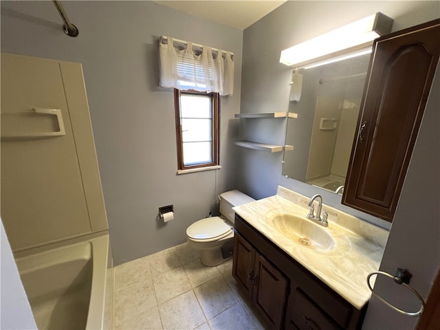 bathroom featuring vanity, tile patterned flooring, and toilet