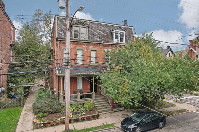 5972 Alder St, Shadyside, PA 15232 - view of front of home featuring brick siding, mansard roof, a porch, and a high end roof
