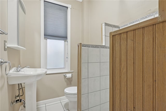 bathroom featuring toilet and tile patterned floors