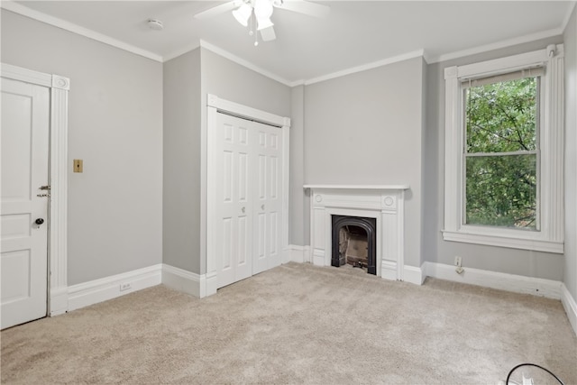 unfurnished living room with light carpet, ornamental molding, and ceiling fan