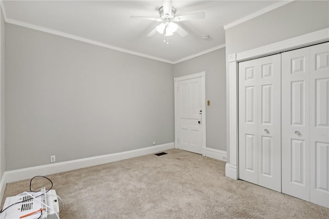 5972 Alder St, Shadyside, PA 15232 - unfurnished bedroom featuring crown molding, carpet, baseboards, a closet, and ceiling fan