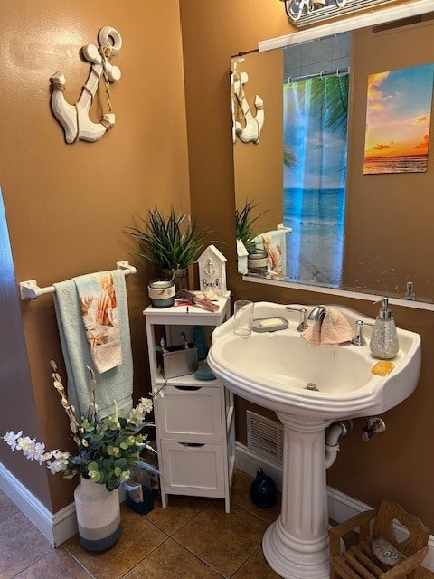 bathroom with tile patterned floors