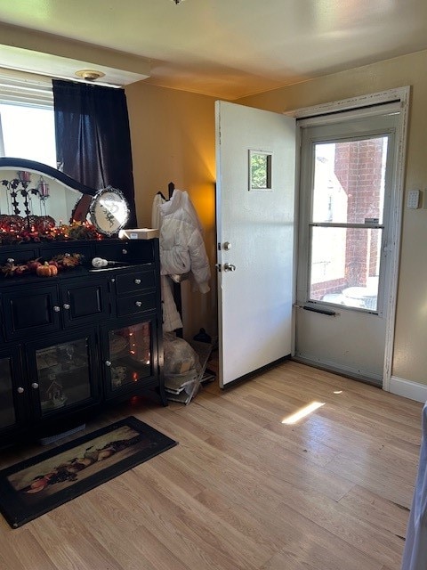 doorway with light wood-type flooring