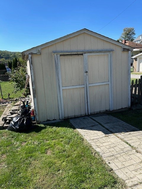 view of outbuilding with a lawn