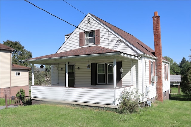 view of front of property featuring cooling unit and a front lawn