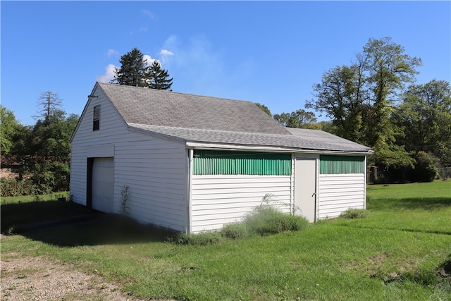 garage featuring a yard