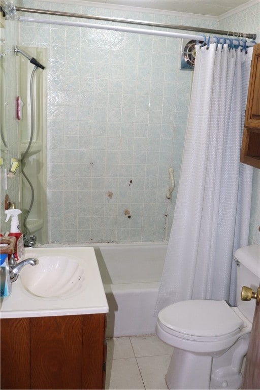 full bathroom with vanity, shower / tub combo, tile patterned floors, crown molding, and toilet