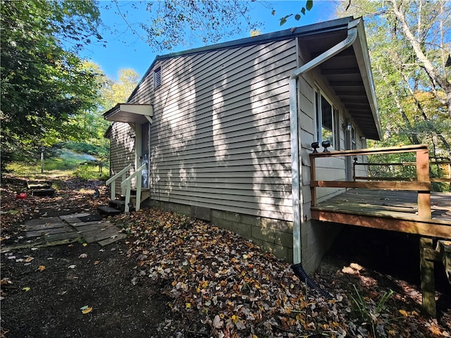 view of side of property featuring a deck