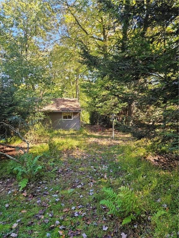 131 Overlook Dr Unit B, Slippery Rock Twp But, PA 16057 - view of yard with a wooded view