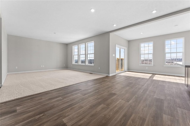 unfurnished living room featuring hardwood / wood-style flooring