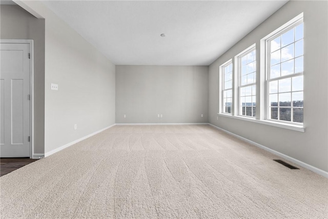 unfurnished room featuring carpet floors