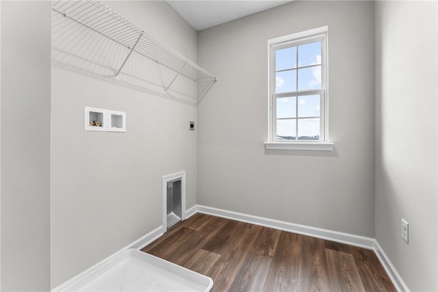 clothes washing area with hookup for an electric dryer, hookup for a washing machine, and dark wood-type flooring