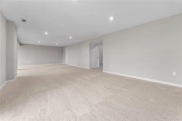 unfurnished room with light colored carpet