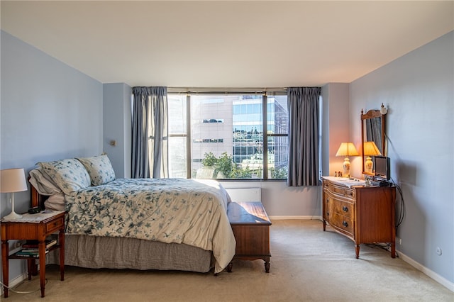 bedroom with light carpet