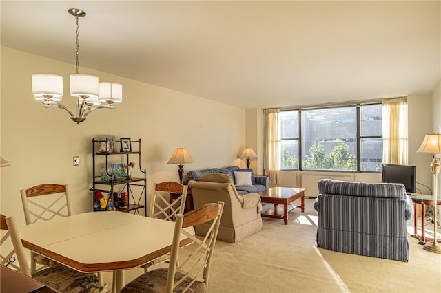 dining area with a chandelier and light colored carpet