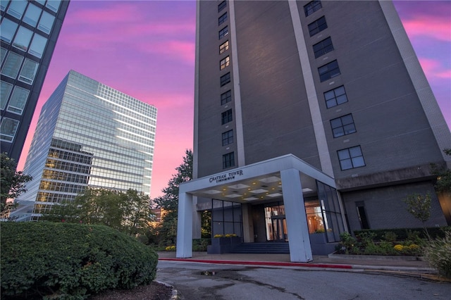 view of outdoor building at dusk