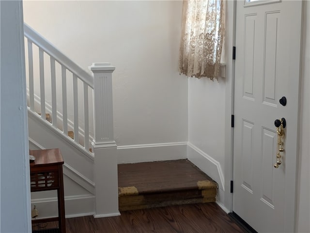 foyer with dark hardwood / wood-style floors