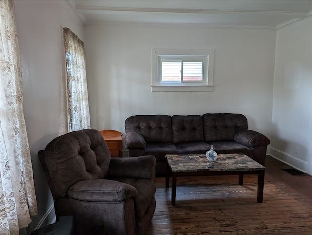 living room featuring dark hardwood / wood-style flooring and ornamental molding