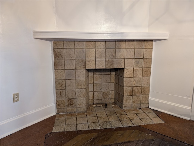 interior details with a tiled fireplace