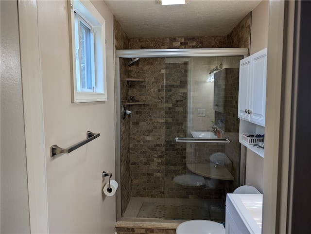 bathroom with toilet and walk in shower