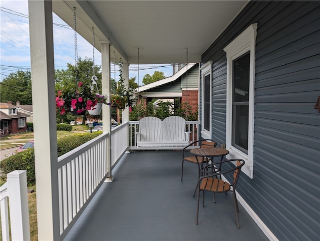 balcony featuring a porch