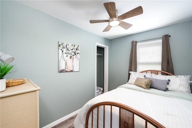 bedroom with wood-type flooring, a closet, and ceiling fan