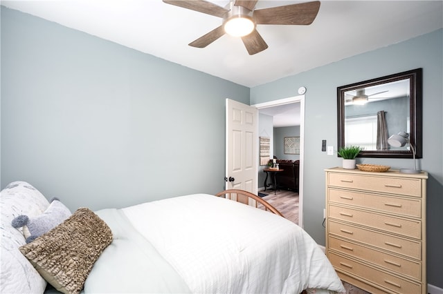 bedroom featuring ceiling fan and hardwood / wood-style flooring