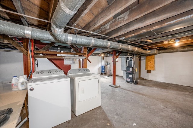 basement with heating unit and independent washer and dryer