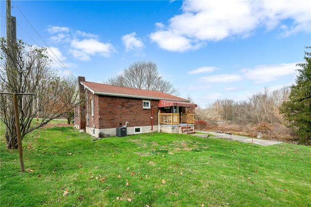 rear view of property with a yard