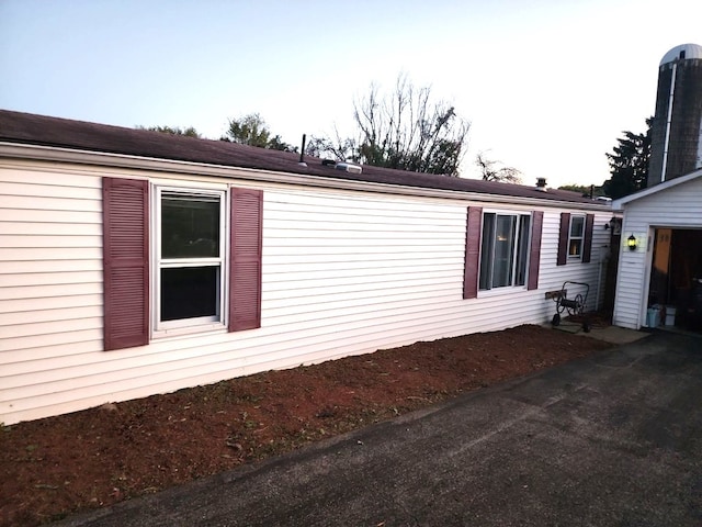 view of side of property featuring a garage