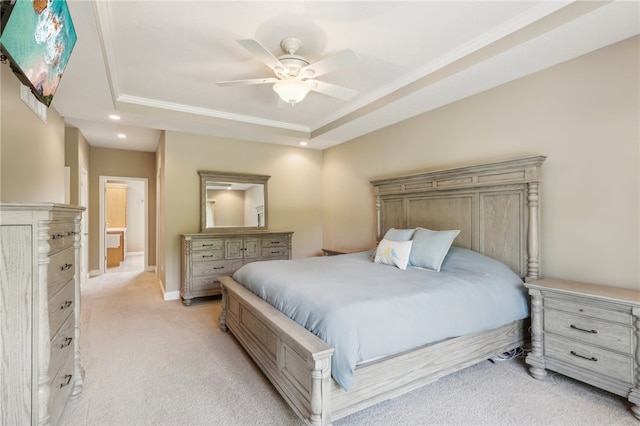 bedroom with a tray ceiling, ceiling fan, and light colored carpet