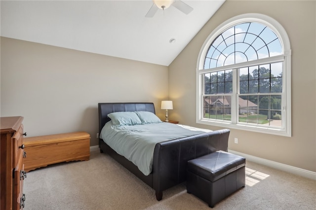 bedroom with ceiling fan, vaulted ceiling, and carpet