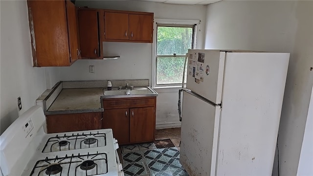 kitchen with white appliances and sink