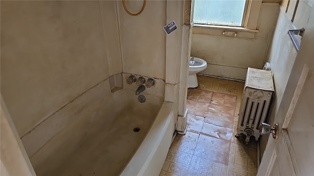 bathroom featuring shower / bathtub combination and toilet