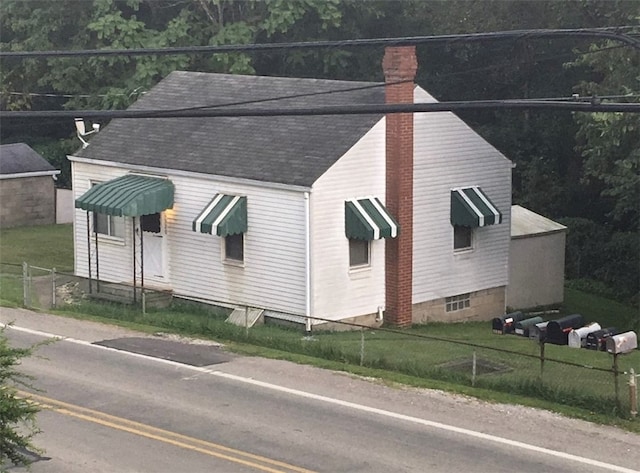 view of side of home featuring a yard