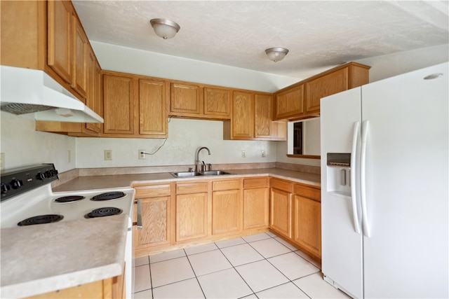 kitchen featuring a textured ceiling, white appliances, sink, and light tile patterned floors