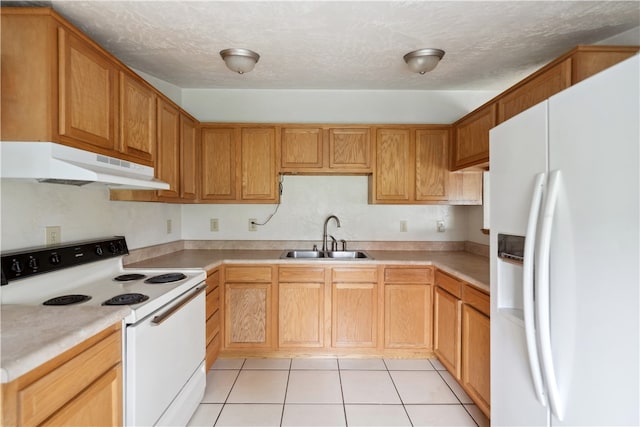 kitchen featuring a textured ceiling, white appliances, light tile patterned flooring, and sink