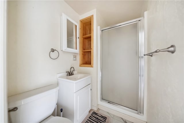 bathroom featuring vanity, tile patterned floors, a shower with shower door, and toilet