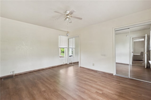 unfurnished bedroom with wood-type flooring and ceiling fan