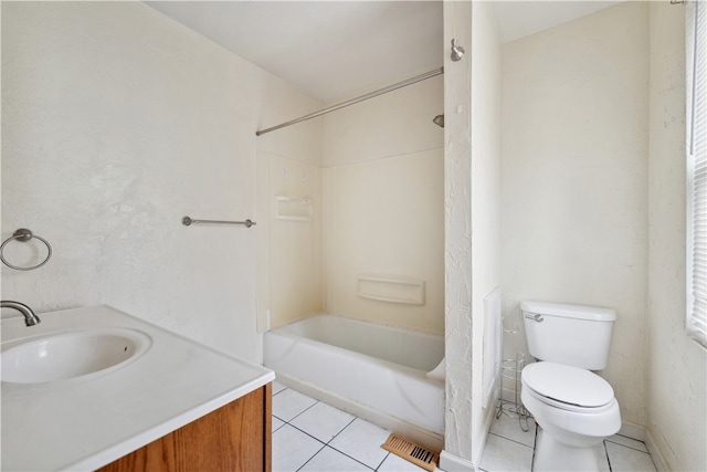 full bathroom featuring tile patterned flooring, bathing tub / shower combination, vanity, and toilet