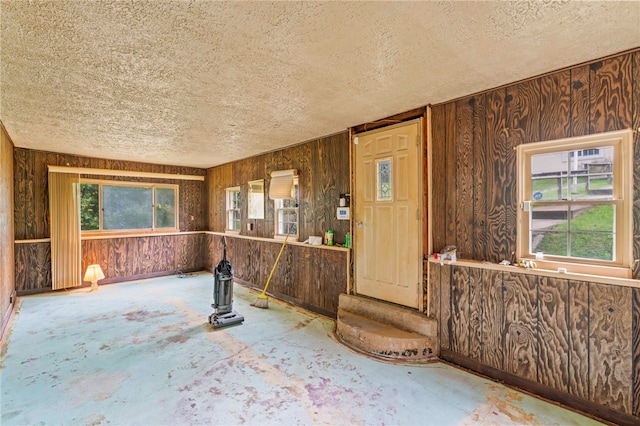 misc room with a wealth of natural light and a textured ceiling