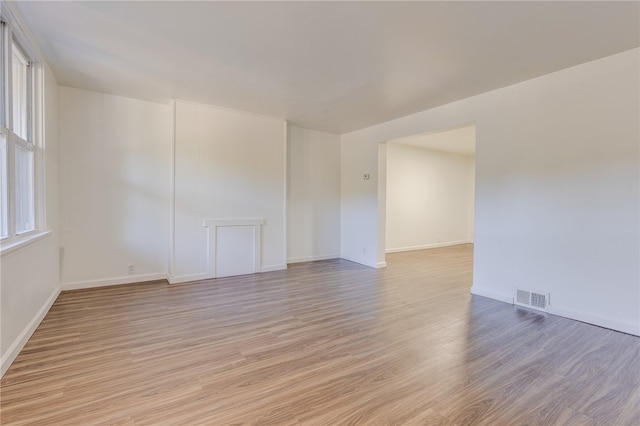 unfurnished room with light hardwood / wood-style flooring