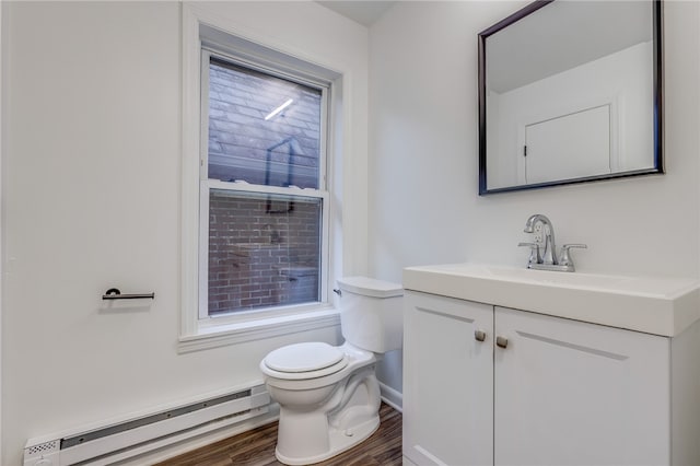 bathroom with vanity, a baseboard radiator, hardwood / wood-style floors, and toilet