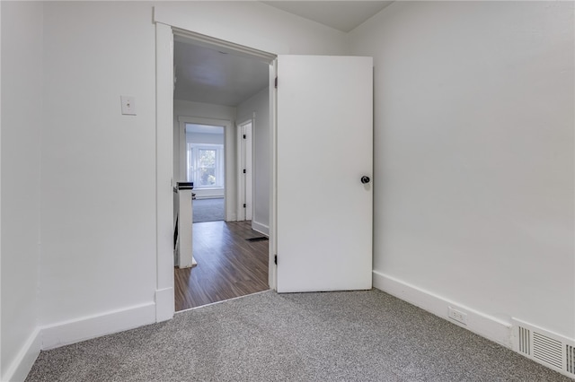 empty room with wood-type flooring